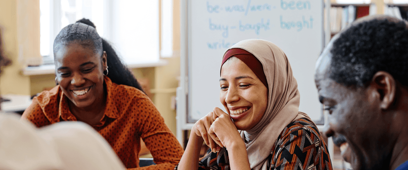 A group of immigrants learning how to build credit in the US