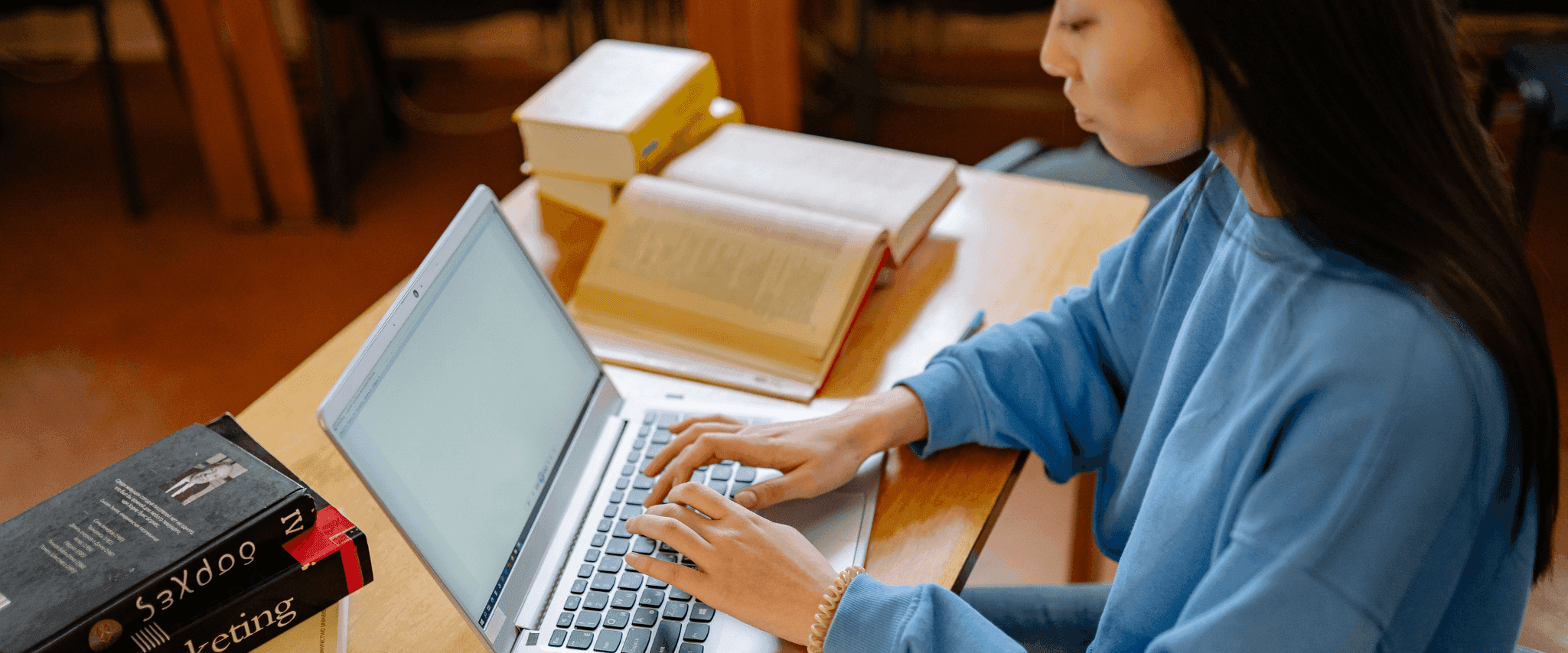 Woman looking up how student loans are impacted by credit scores
